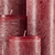 Bika Candles Lotuskerze Weinrot mit geöffneten Blütenflügeln beim Abbrennen